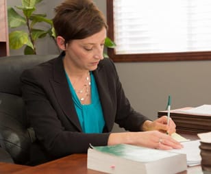 Photo of Jodi Marie Terzich working in her office